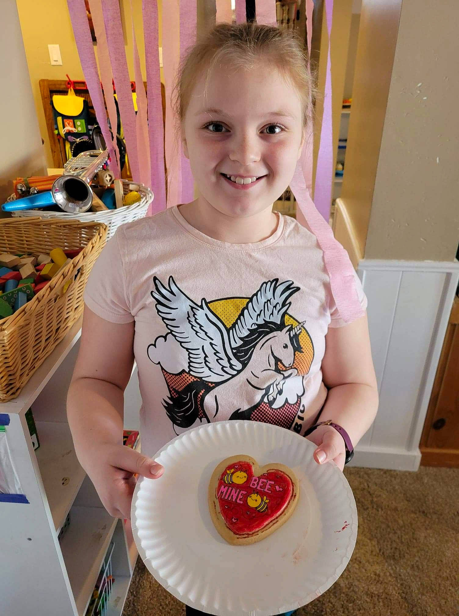 Talulah is registered to the contest to win money with this photo: chair, child, dishware, fun, happy, joy, mammal, necklace, person, plate, platter, play, porcelain, room, serveware, sleeve, smile, t_shirt, tableware, textile