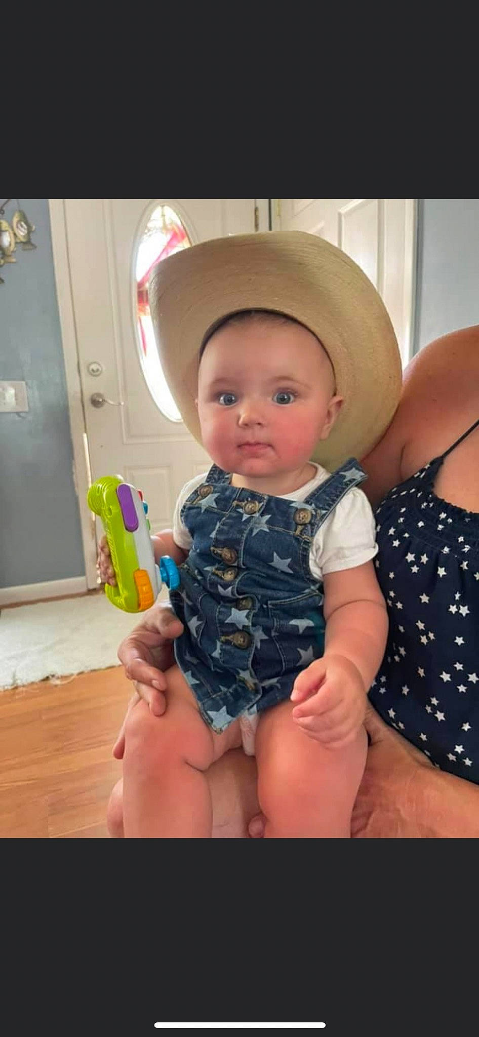 Oakley is registered to the contest to win money with this photo: abdomen, baby, baby_toddler_clothing, cool, eye, face, fun, gesture, happy, hat, human_body, iris, mouth, neck, person, skin, sun_hat, thigh, toddler, trunk