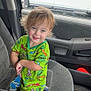 Grayson joined the competition — help win amazing prizes! air_freshener, car_interior, car_seat, casual, child, clothing, green_shirt, happy, indoor, person, portrait, seat, short_hair, sitting, smiling, teenage_mutant_ninja_turtles, toddler, toy, vehicle, window