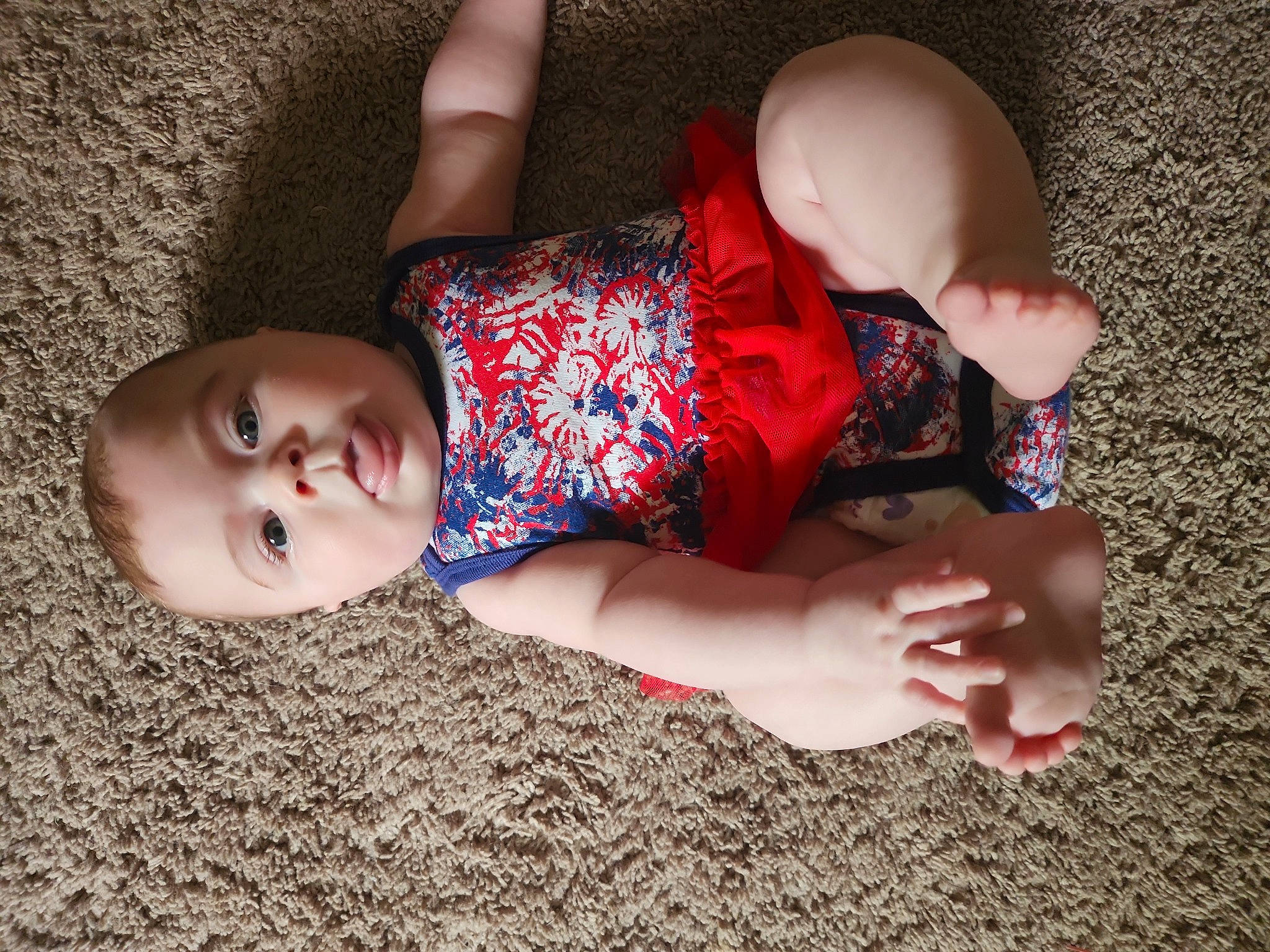 Harley is registered to the contest to win money with this photo: baby, baby_toddler_clothing, elbow, eye, finger, fun, grass, hand, happy, joint, lip, mouth, pattern, person, skin, textile, thigh, toddler, tree, trunk