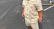 Joandry is registered to the contest to win money with this photo: toddler, child, braided_hair, sunglasses, shorts, shirt, smiley_face_pattern, sneakers, bracelet, necklace, earrings, outdoor, paved_driveway, white_picket_fence, cardboard_box, tools, confident, fashionable, standing, side_profile