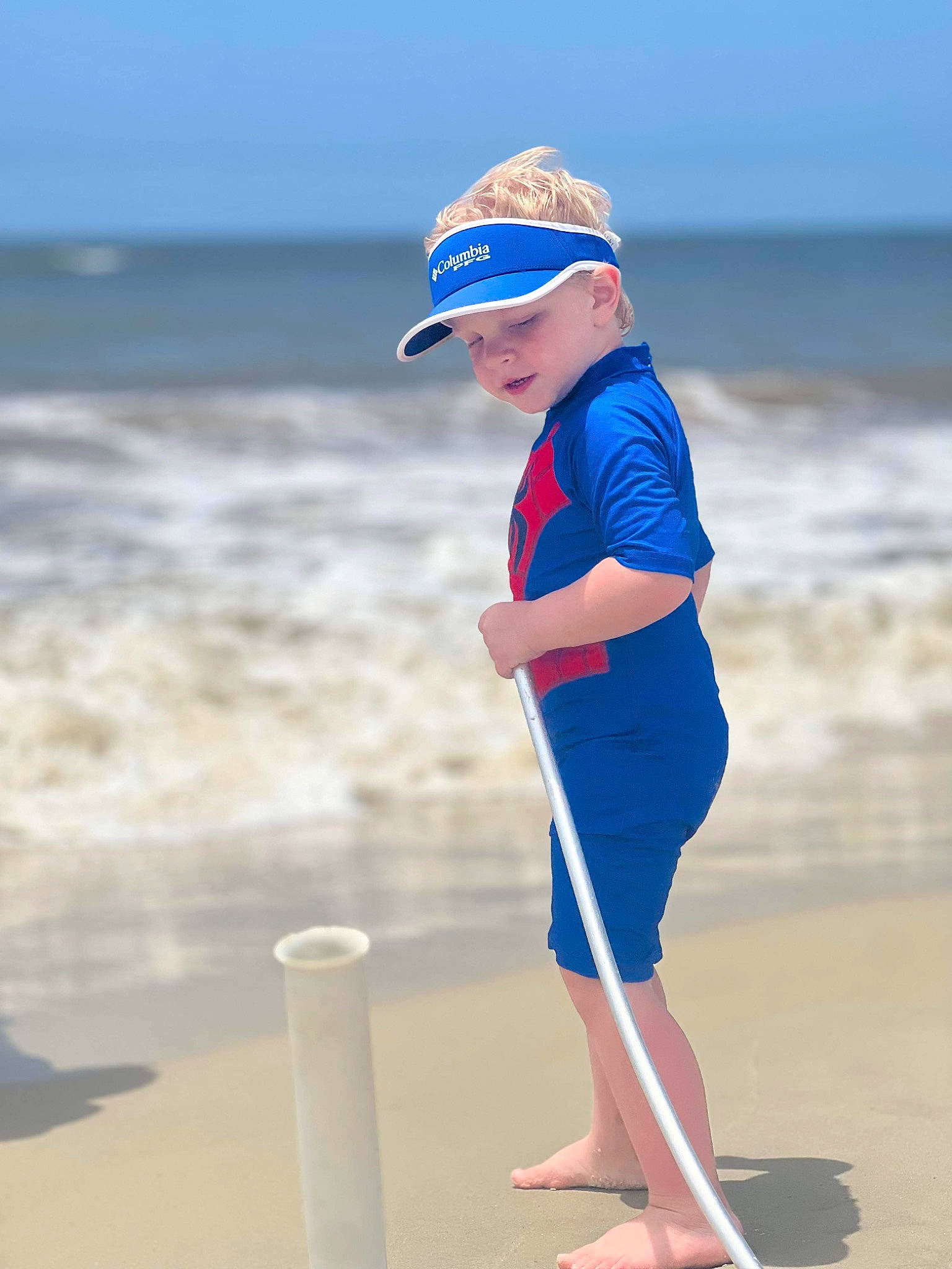 Mally is registered to the contest to win money with this photo: balance, barefoot, baseball_cap, beach, cap, electric_blue, fun, happy, headwear, leisure, people_on_beach, person, recreation, sand, shore, sky, sleeve, toddler, travel, water