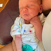 Bauer joined the competition — help win amazing prizes! baby, newborn, sleeping, infant, pacifier, onesie, colorful, arm, hand, skin, indoor, furniture, chair, wood, table, peaceful, cute, child, person, resting
