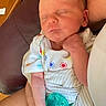 baby, newborn, sleeping, infant, pacifier, onesie, colorful, arm, hand, skin, indoor, furniture, chair, wood, table, peaceful, cute, child, person, resting