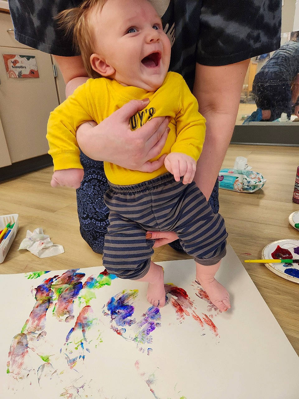 Bruce joined the competition — help win amazing prizes! art, artist, baby_toddler_clothing, child, event, flooring, fun, happy, leisure, paint, party, pattern, person, play, sharing, shorts, sitting, smile, t_shirt, toddler