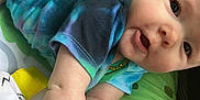Keira joined the competition — help win amazing prizes! baby, child, crawling, tie_dye_shirt, play_mat, toy, soft_toy, colorful, close_up, infant, cute, face, skin, arm, hand, foot, expression, indoors, person, young