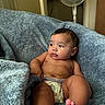 Braylen joined the competition — help win amazing prizes! baby, barefoot, blanket, blue_blanket, chair, child, cozy, diaper, eyes, face, fan, feet, hair, home, indoors, infant, photography, portrait, sitting, skin