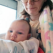 Irys participe au concours pour gagner de l'argent avec cette photo : baby, infant, adult, woman, glasses, blanket, window, indoor, portrait, selfie, holding, face, eyes, clothing, cozy, home, parent, child, cuddling, towel