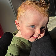 Nico is registered to the contest to win money with this photo: baby, child, blue_eyes, ginger_hair, spiky_hair, green_clothing, smiling, sunlight, portrait, closeup, face, skin, person, happy, infant, cheeks, indoor, legs, clothing, cute