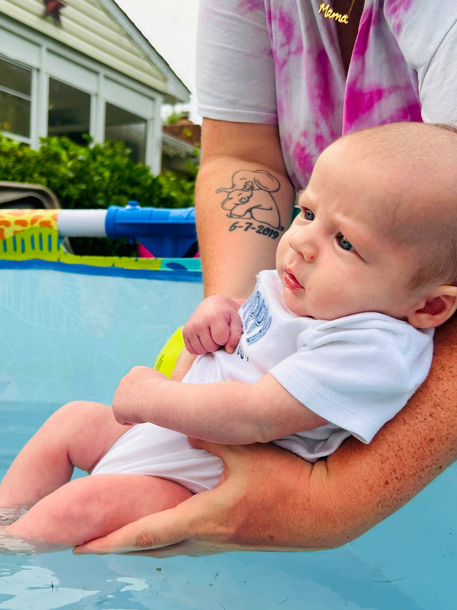 Deluca joined the competition — help win amazing prizes! abdomen, baby, barefoot, child, event, foot, fun, grass, happy, hat, human_leg, knee, leg, leisure, person, recreation, shorts, sitting, swimming_pool, thigh