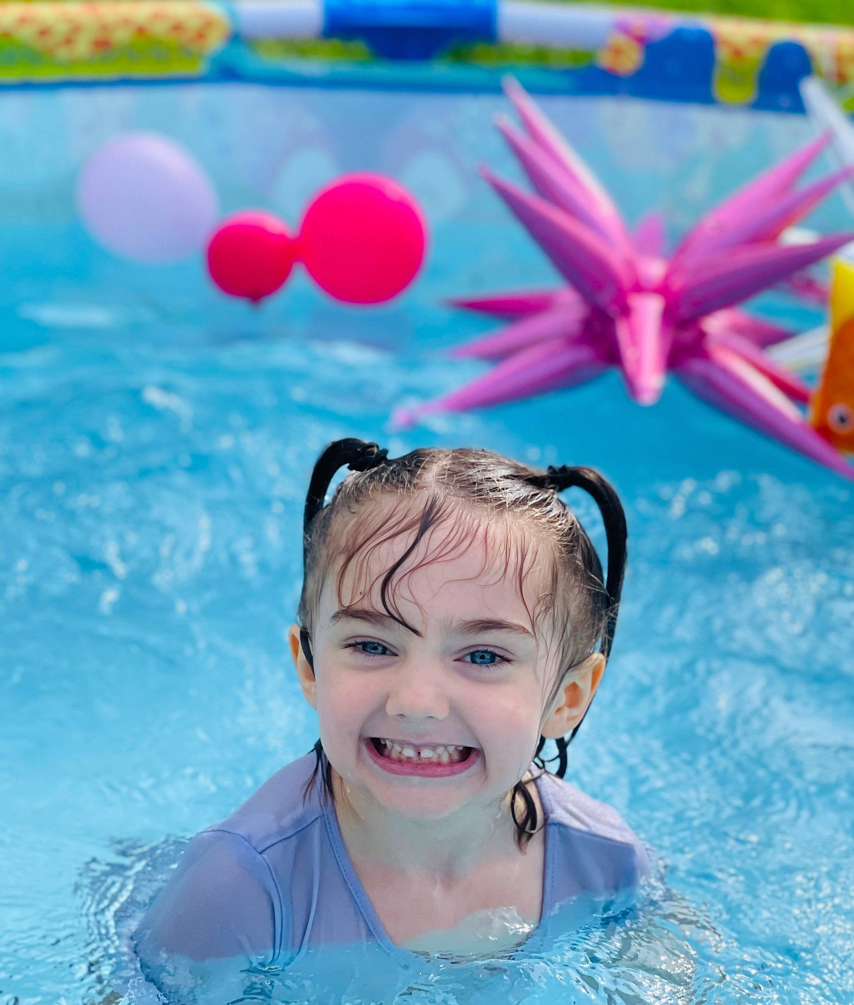 Leanna is registered to the contest to win money with this photo: aqua, azure, bathing, event, fun, happy, joy, leisure, magenta, party_supply, person, personal_protective_equipment, petal, photograph, pink, recreation, smile, snapshot, summer, swimming_pool