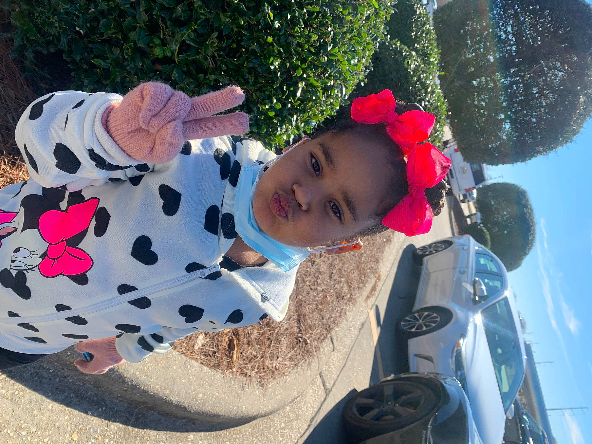 Leah joined the competition — help win amazing prizes! automotive_exterior, automotive_lighting, car, design, electric_blue, fun, grass, happy, hat, headgear, hood, leisure, person, pink, plant, recreation, sky, tire, toddler, toy