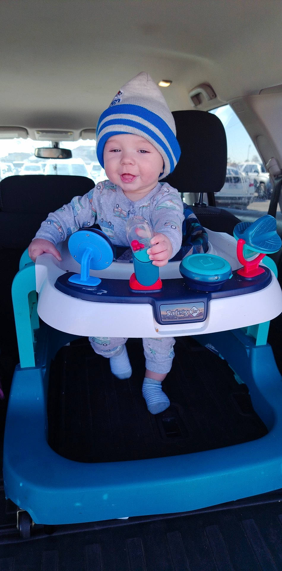 Jc Vincent is registered to the contest to win money with this photo: auto_part, automotive_design, automotive_exterior, azure, baby, baby_toddler_clothing, bumper, car, car_seat, child, electric_blue, fun, headwear, motor_vehicle, person, product, smile, toddler, vehicle, vehicle_door