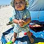 toddler, child, beach, sand, sun_hat, swimwear, blue_shirt, shorts, sunny, outdoor, barefoot, playing, sand_toys, tent, backpack, water_toys, happy, summer, vacation, portrait
