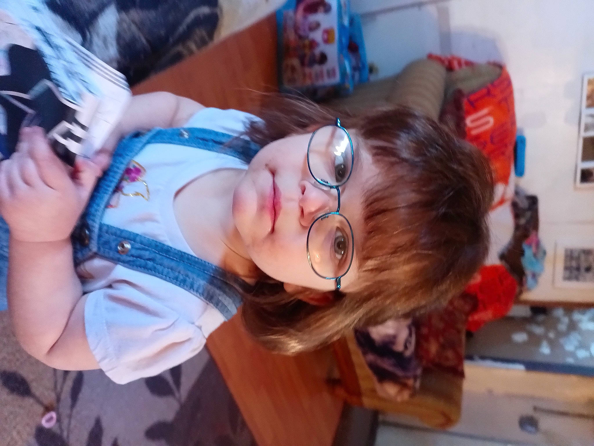 Savannah is registered to the contest to win money with this photo: black_hair, child, eyewear, fun, glasses, hair_coloring, happy, leisure, mouth, nose, person, plant, room, smile, toddler, vacation, vision_care