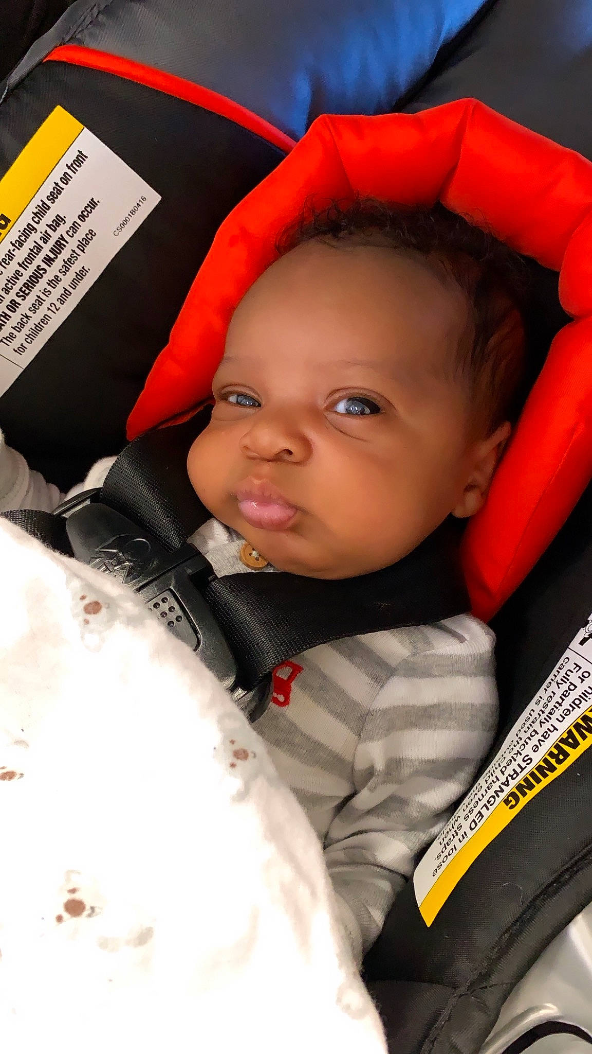 Donté is registered to the contest to win money with this photo: baby, car_seat, cheek, child, person, toddler