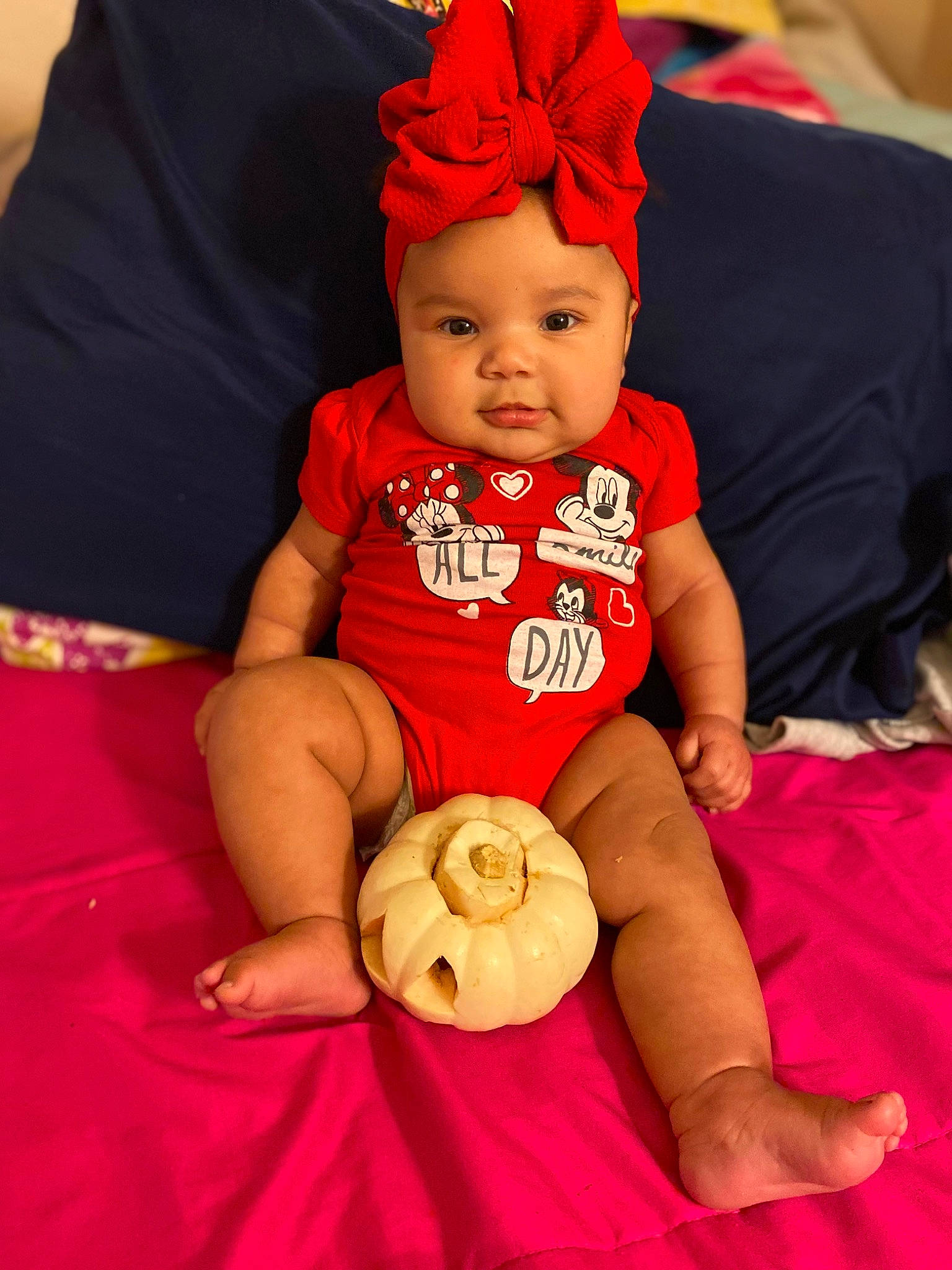 Aviannah joined the competition — help win amazing prizes! baby, baby_toddler_clothing, cap, cheek, comfort, eye, facial_expression, finger, happy, headgear, headwear, human_body, orange, person, pink, red, shorts, skin, sleeve, textile