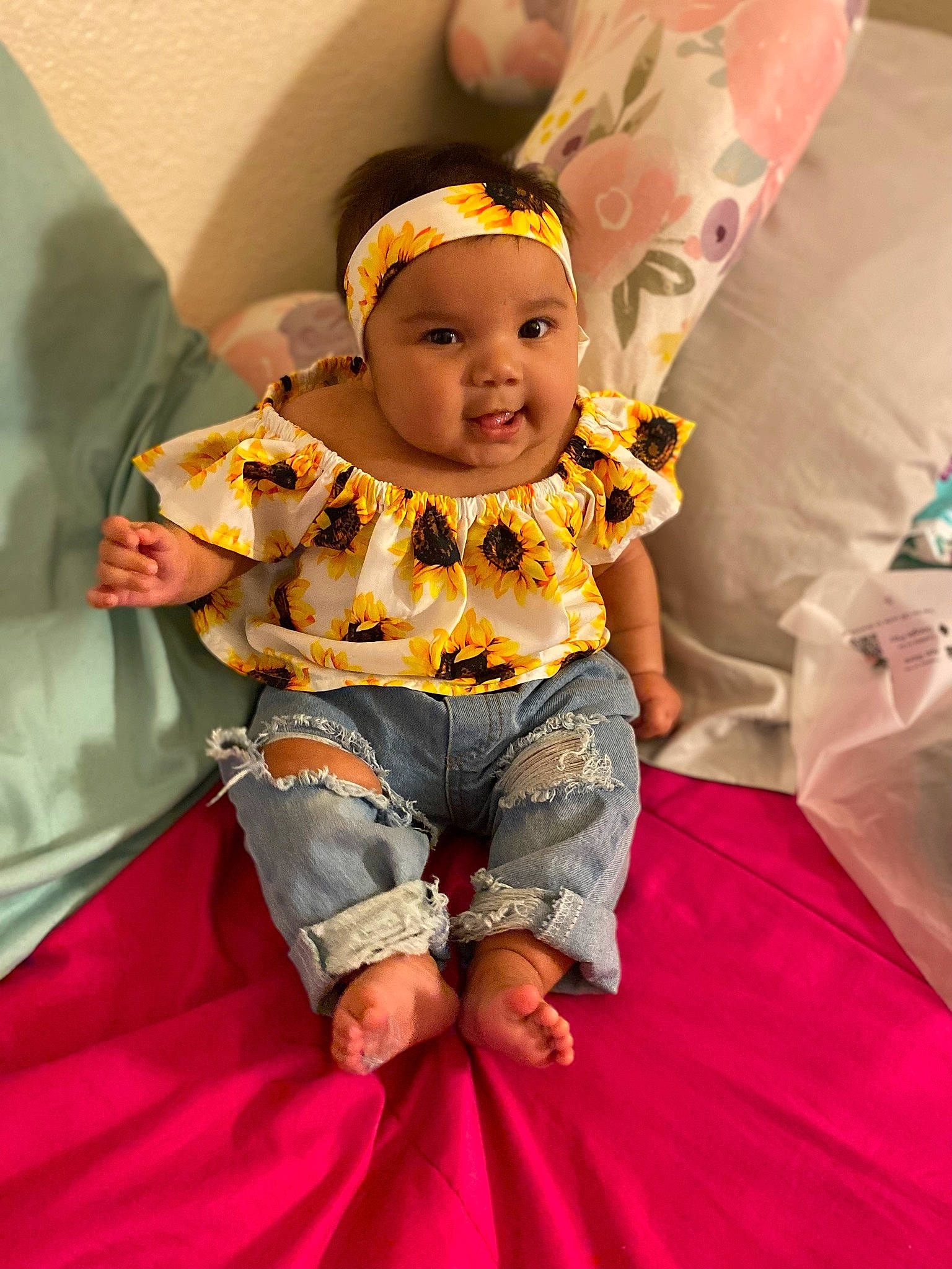 Aviannah joined the competition — help win amazing prizes! baby, baby_toddler_clothing, child, design, event, fun, grass, happy, headwear, human_body, leisure, magenta, person, pink, recreation, shorts, sitting, skin, sleeve, smile