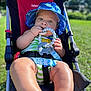 Liam is registered to the contest to win money with this photo: baby, child, stroller, sunhat, teething_toy, elephant_toy, outdoor, green_grass, sunny, onesie, infant, cute, chubby_legs, baby_toys, summer, park, seatbelt, blue, striped_clothing, portrait