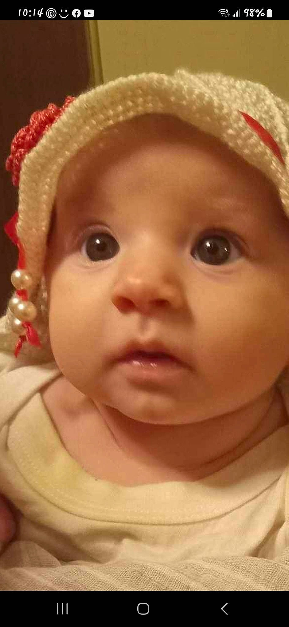 Amelia is registered to the contest to win money with this photo: baby, cap, cheek, chin, eye, eyebrow, eyelash, face, facial_expression, hat, head, headwear, human_body, iris, lip, mouth, nose, organ, person, photograph