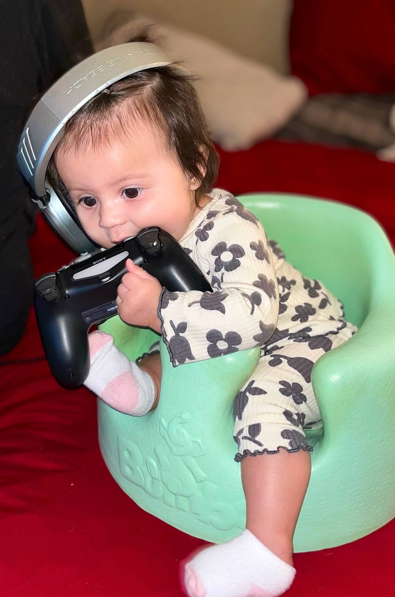 Elena is registered to the contest to win money with this photo: audio_equipment, baby, baby_toddler_clothing, comfort, eye, flash_photography, fun, hair, hairstyle, happy, head, helmet, human_body, mouth, person, personal_protective_equipment, sitting, skin, sleeve, thigh