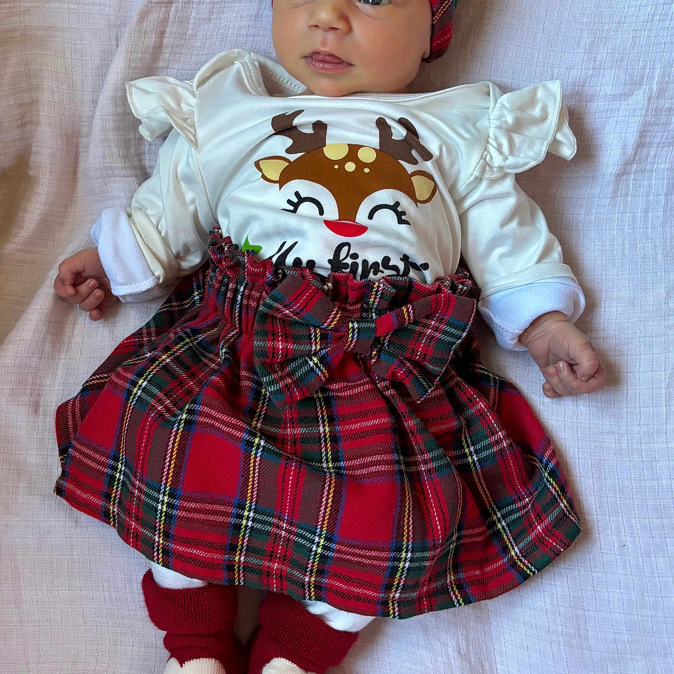 Eleanor joined the competition — help win amazing prizes! adorable, baby, blanket, bright_eyes, child, cozy, cute, expression, festive_clothing, heart_socks, holiday_theme, indoors, infant, lying_down, portrait, red_headband, small_hands, soft_light, tartan_skirt, white_shirt