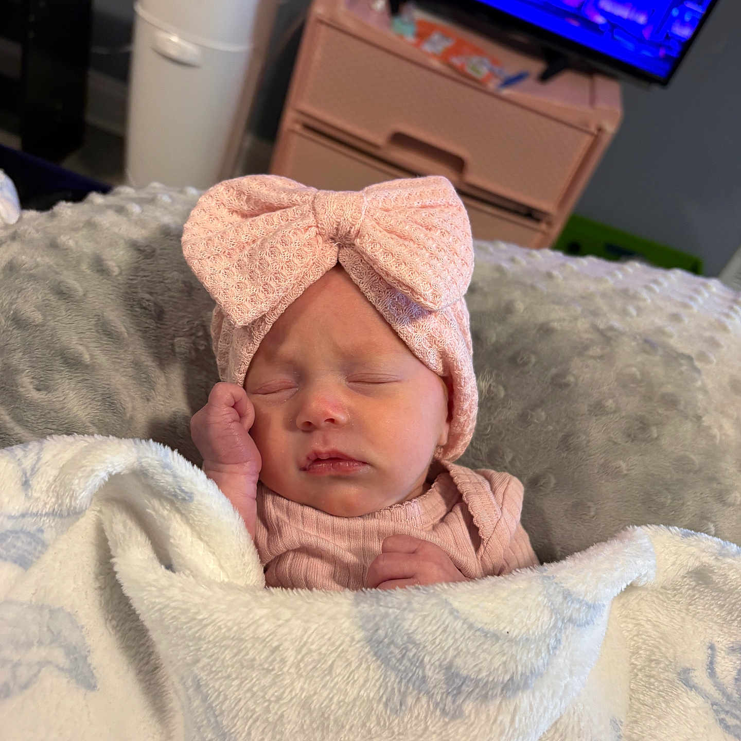 Hazleigh joined the competition — help win amazing prizes! baby, newborn, sleeping, blanket, headband, pink_bow, cozy, soft, cushion, infant, indoors, furniture, television, sleep, child, cute, resting, peaceful, portrait, person