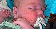 Buddy joined the competition — help win amazing prizes! baby, sleeping, pacifier, blanket, infant, hand, face, cozy, closeup, soft, polka_dot, fabric, rest, newborn, cute, child, wrapped, peaceful, nap, indoors