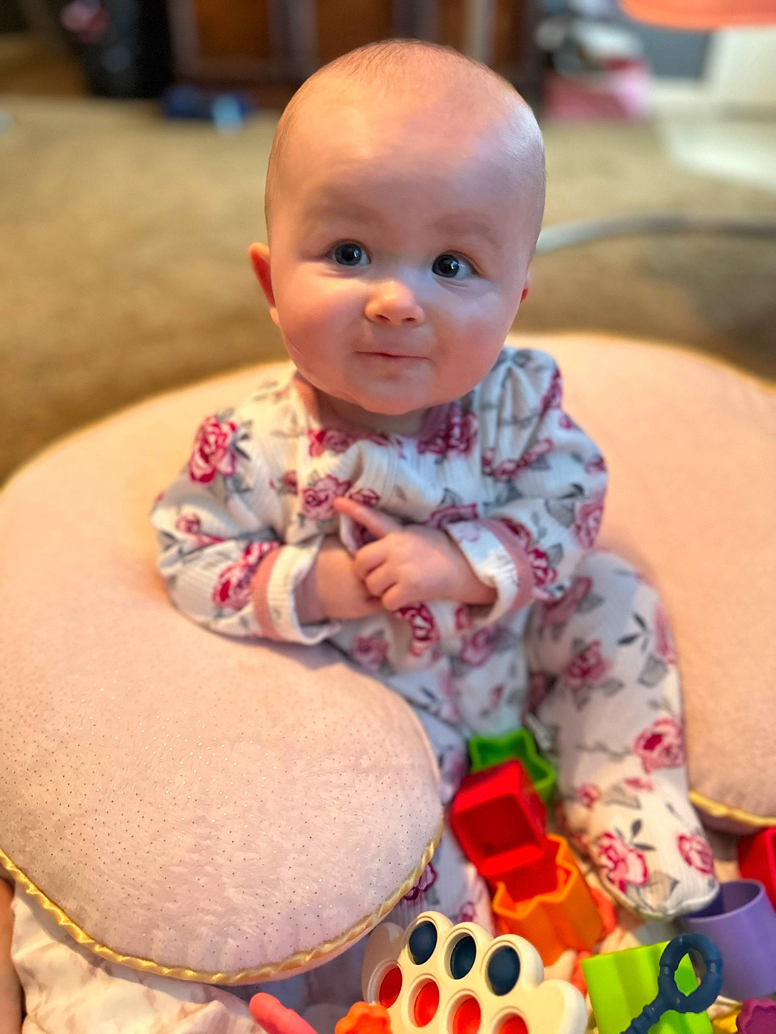 Emberleigh is registered to the contest to win money with this photo: abdomen, baby, baby_playing_with_toys, baby_toddler_clothing, cheek, child, comfort, event, facial_expression, flooring, fun, happy, head, pattern, person, sitting, skin, smile, toddler, toy