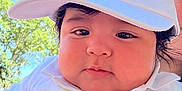 Danny Rodenas joined the competition — help win amazing prizes! baby, child, face, hat, cap, white_clothing, polo_shirt, outdoor, daylight, trees, sky, portrait, cute, chubby_cheeks, person, infant, young_child, summer, sunlight, casual_wear