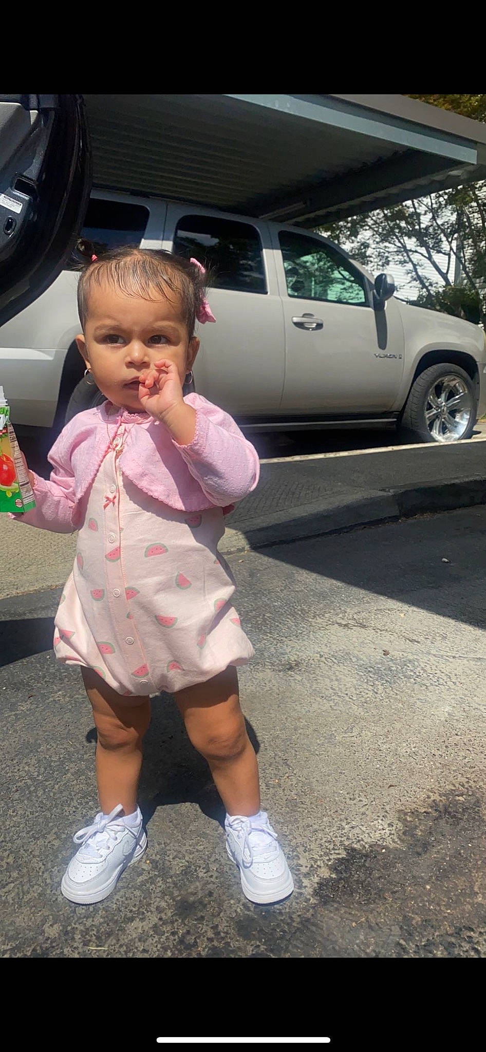 Sequoia is registered to the contest to win money with this photo: asphalt, automotive_exterior, automotive_lighting, automotive_tire, baby_toddler_clothing, car, finger, fun, gesture, motor_vehicle, person, pink, sleeve, snapshot, thumb, tire, toddler, vehicle, vehicle_door, wheel