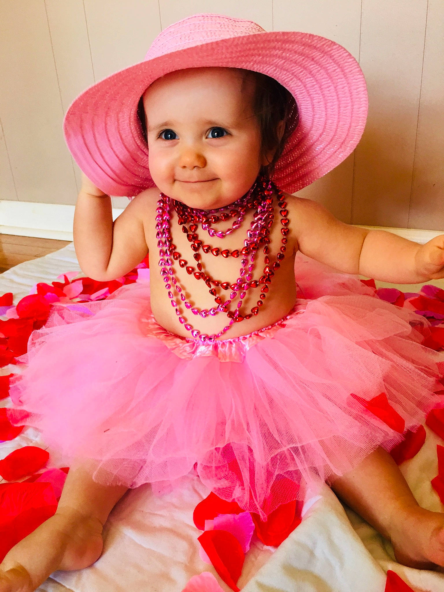 Rynlee is registered to the contest to win money with this photo: baby_toddler_clothing, costume_hat, dress, embellishment, fashion, happy, hat, headgear, headpiece, headwear, joy, magenta, person, pink, purple, red, ruffle, skin, smile, sun_hat