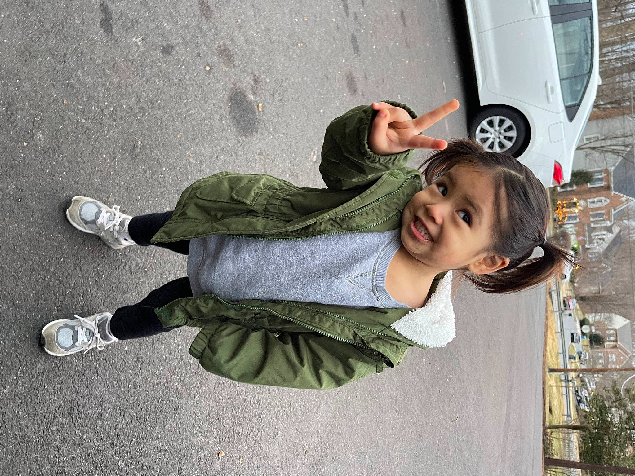 Izabelle is registered to the contest to win money with this photo: asphalt, automotive_exterior, automotive_lighting, automotive_tire, car, dress, fun, happy, human_leg, joy, motor_vehicle, person, plant, road_surface, smile, street_fashion, tire, toddler, tree, vehicle_door