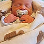 Finn is registered to the contest to win money with this photo: baby, bed, blanket, child, comfort, cozy, cute, face, hands, indoors, infant, newborn, pacifier, peaceful, resting, sleeping, soft, toddler, warm, wrapped