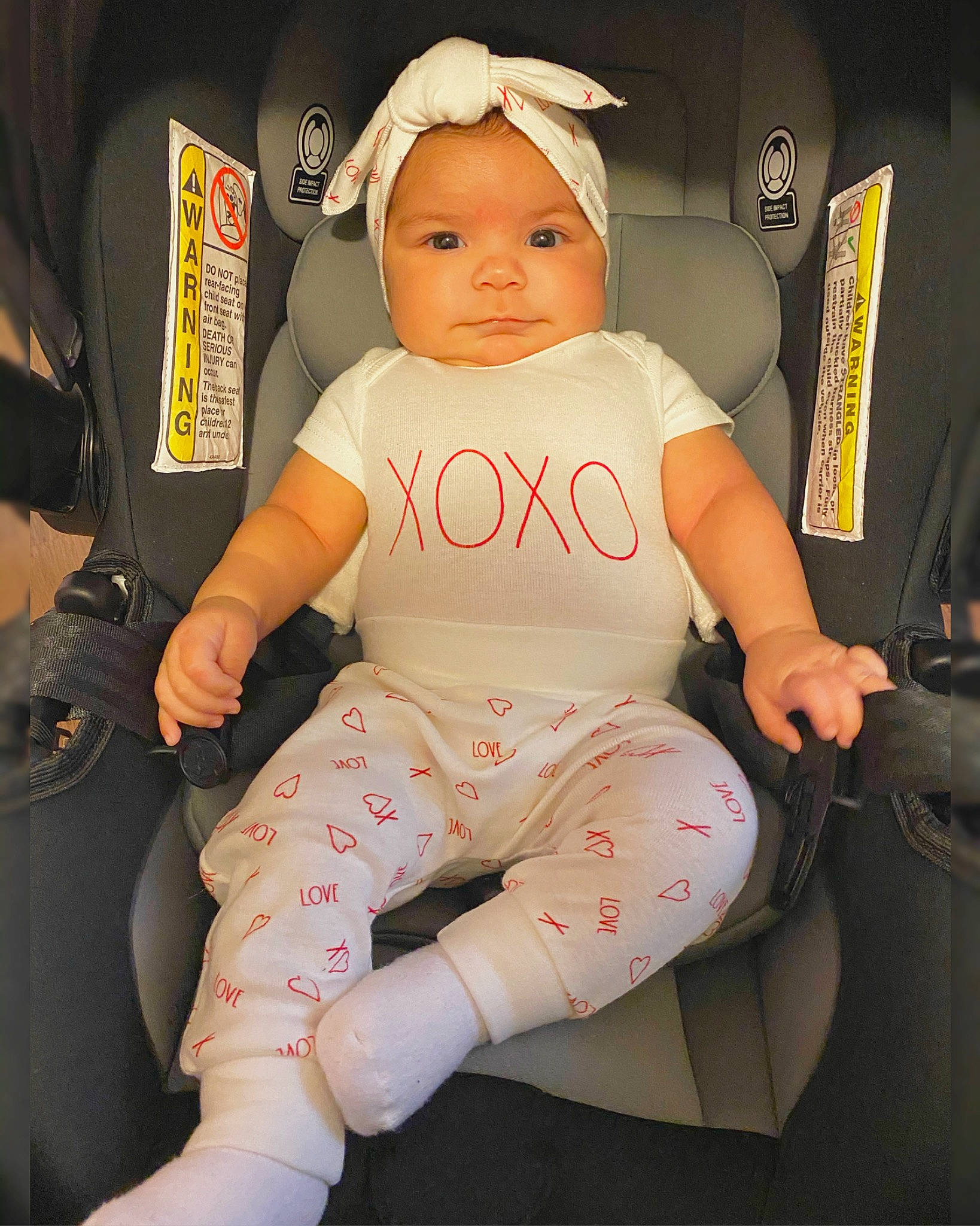 Mercedes is registered to the contest to win money with this photo: arm, auto_part, baby, baby_carriage, baby_products, baby_toddler_clothing, bag, car_seat, chair, cheek, comfort, eye, finger, head, headwear, human_leg, knee, lap, person, thigh