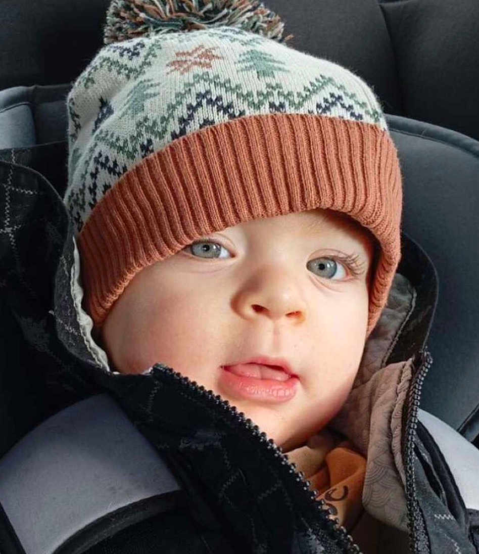 Francescu-Maria participe au concours pour gagner de l'argent avec cette photo : baby, blue_eyes, car_seat, child, close_up, cold_weather, cozy, cute, expression, face, infant, jacket, knit_hat, outdoor_gear, person, pom_pom, portrait, warm, winter_clothing, young_child