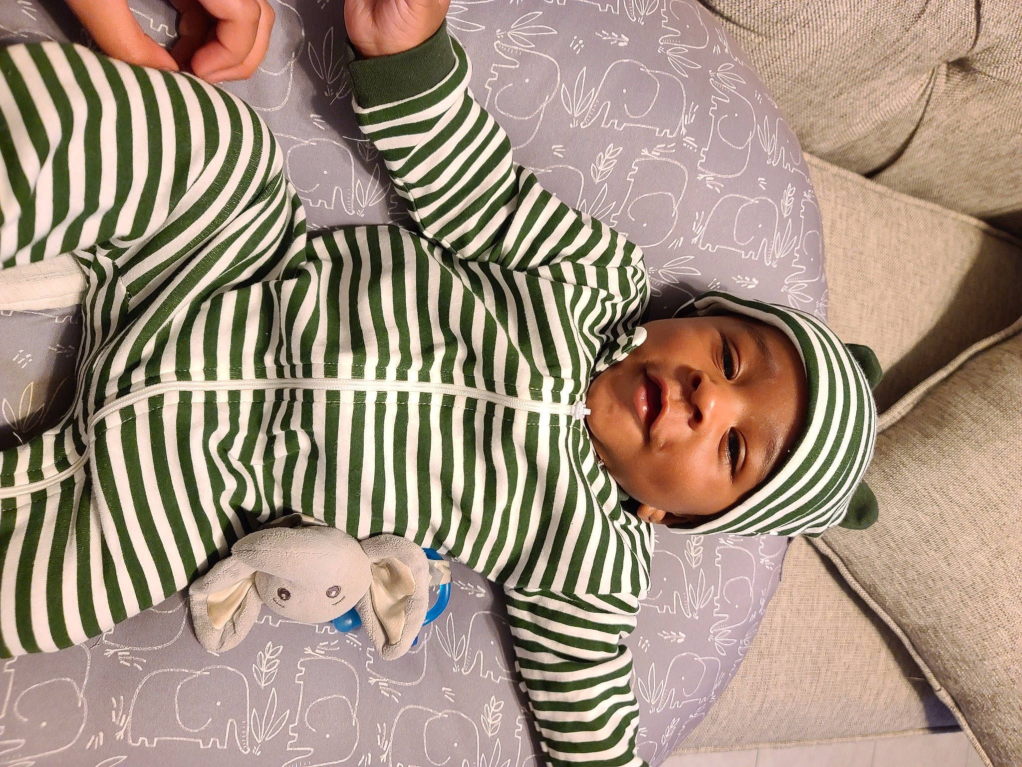 Kingjerell joined the competition — help win amazing prizes! baby, baby_toddler_clothing, child, comfort, elbow, facial_expression, finger, fun, happy, headgear, headwear, human_leg, linens, mammal, pattern, person, sitting, sleeve, textile, thigh