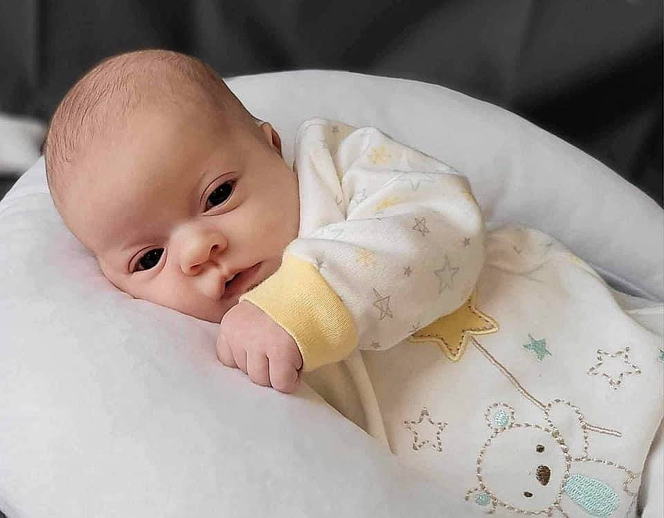 Lillian joined the competition — help win amazing prizes! baby, baby_products, baby_sleeping, baby_toddler_clothing, cheek, child, collar, comfort, eye, face, facial_expression, happy, human_body, linens, nail, person, sitting, skin, sleeve, textile