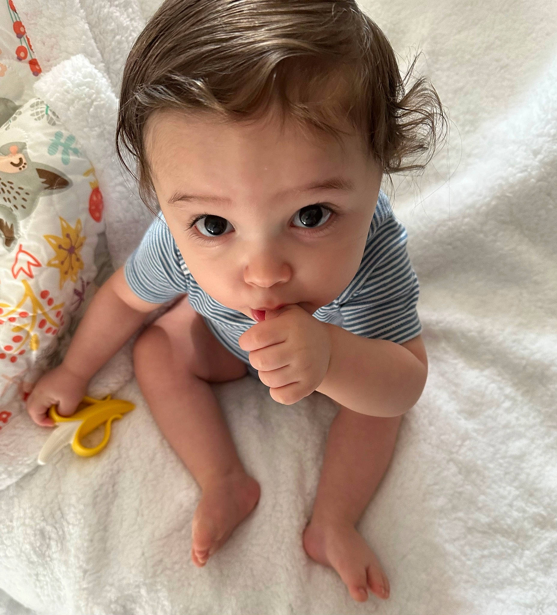 Benjamin is registered to the contest to win money with this photo: arm, baby, baby_toddler_clothing, cheek, comfort, eye, eyelash, finger, gesture, hand, happy, iris, lip, mouth, nail, nose, person, skin, sleeve, thumb