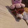 Athéna participe au concours pour gagner de l'argent avec cette photo : animal, brown, cute, dog, floor, funny, heart_shaped, indoor, octopus, pet, pink, plush_toy, relaxed, resting, sleeping, sunglasses, toy, wearing, white, wooden_floor