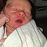 Rowan is registered to the contest to win money with this photo: newborn, baby, infant, sleeping, face, eyes_closed, open_mouth, swaddled, blanket, hospital, portrait, close_up, peaceful, resting, hand, fist, cheek, indoors, medical_equipment, photography