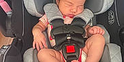 Adeline is registered to the contest to win money with this photo: baby, car_seat, child, comfort, feet, graco, grey, hand, headrest, indoor, infant, legs, newborn, onesie, pink, safety_harness, seat, sleeping, straps, toddler