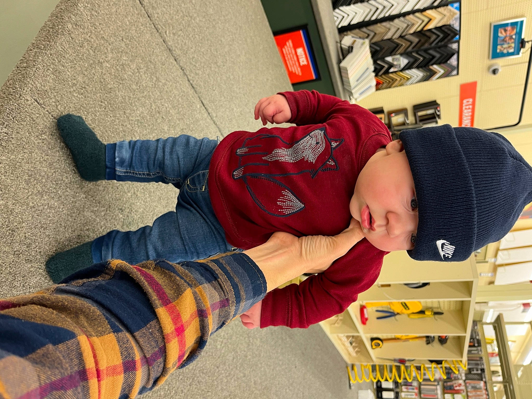 Issac joined the competition — help win amazing prizes! baseball_cap, cap, carmine, child, comfort, flooring, foot, fun, hat, headwear, human_leg, pattern, person, plaid, play, sitting, sleeve, sock, t_shirt, thigh