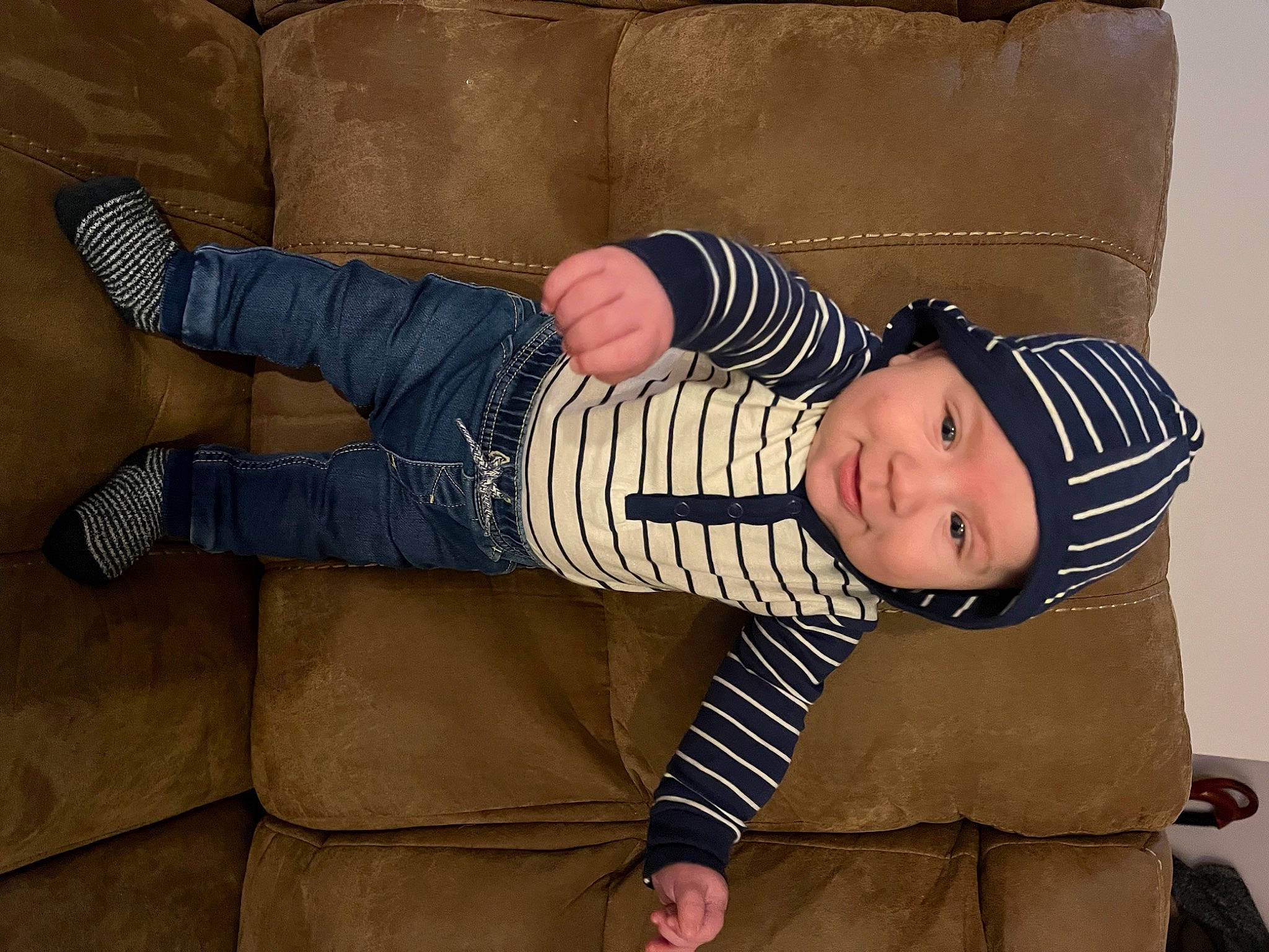 Issac joined the competition — help win amazing prizes! baby, baby_products, baby_toddler_clothing, child, comfort, denim, foot, hat, headwear, human_body, human_leg, lap, pattern, person, sitting, sleeve, sock, toddler, wood