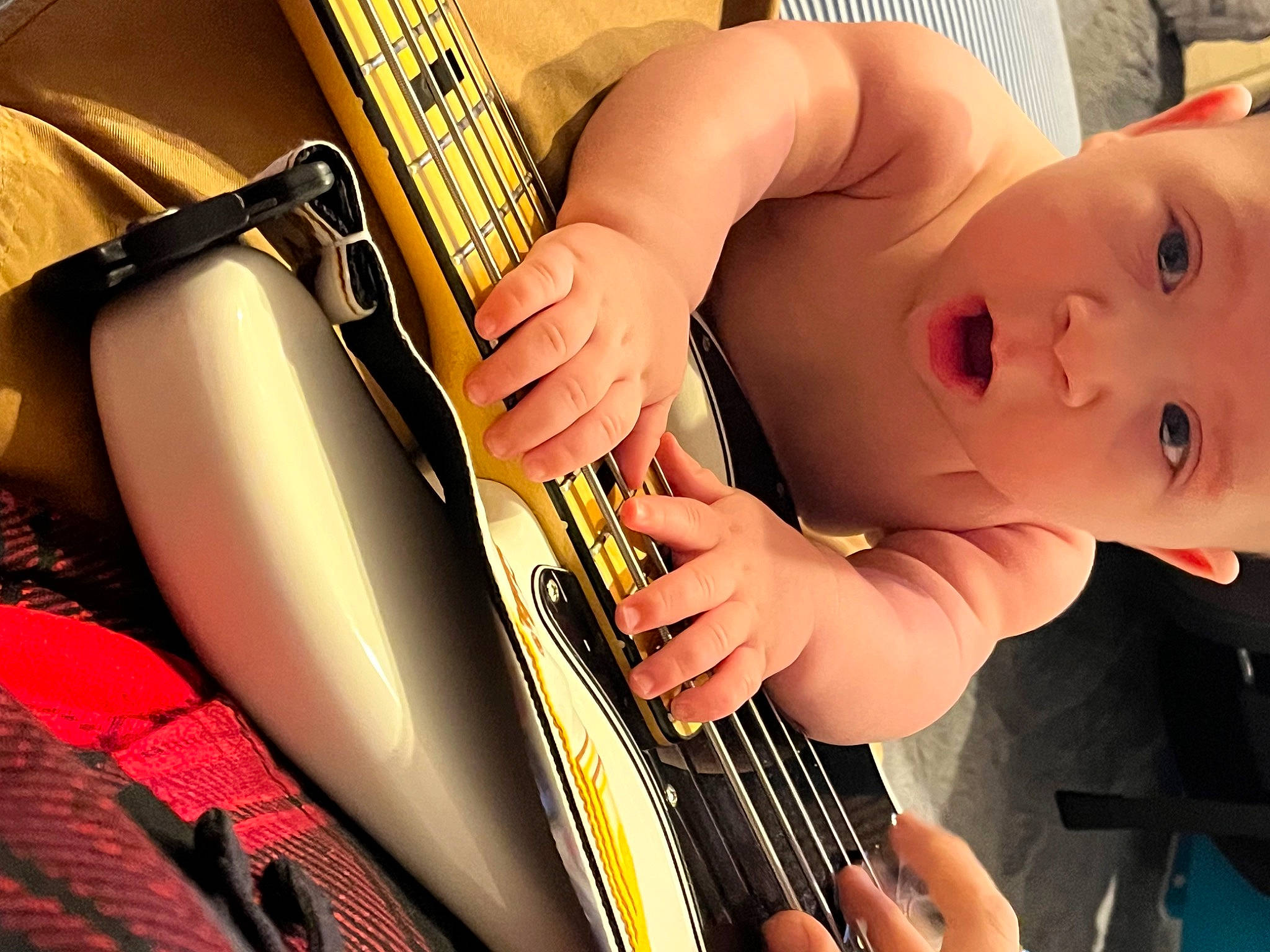Issac joined the competition — help win amazing prizes! arm, automotive_design, baby, baby_toddler_clothing, car_seat, eyelash, finger, fun, hand, human_body, musical_instrument, nail, person, plucked_string_instruments, product, string_instrument, string_instrument_accessory, thumb, toddler, vehicle_door