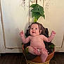 baby, bare_chest, cabinet, child, cute, decor, feet, furniture, greenery, hands, indoors, infant, leaf, mandrake, plant_pot, playful, pottery, skin, smiling, wood_floor