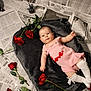 Odessa joined the competition — help win amazing prizes! baby, calm_expression, child, cute, face, gray_blanket, indoor, infant, lying_down, newspaper_background, peaceful, photography, pink_dress, portrait, props, red_rose, roses, soft_texture, studio_setup, white_socks