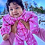 baby, child, pink_snowsuit, snow, outdoor, winter_clothing, smiling, forest, trees, blue_sky, curly_hair, person, holding_hands, cold_weather, cute, infant, happy, winter, nature, playful