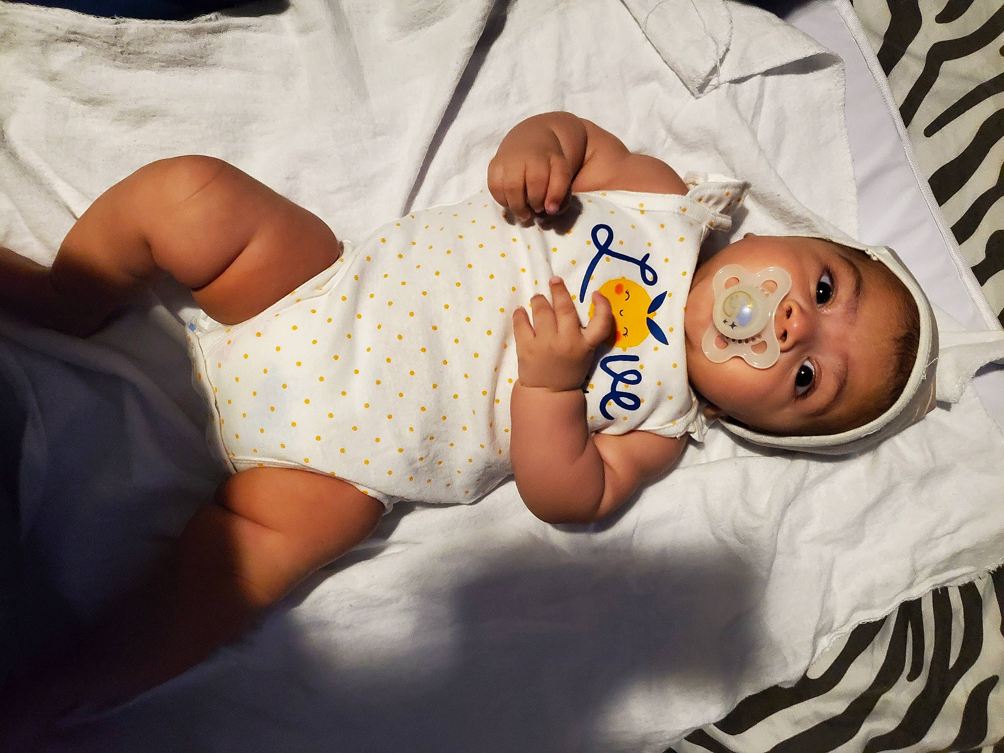 Artemis is registered to the contest to win money with this photo: abdomen, baby, baby_safety, baby_sleeping, baby_toddler_clothing, comfort, elbow, eye, hand, happy, human_body, joint, leg, linens, mouth, person, skin, sleeve, thigh, toddler