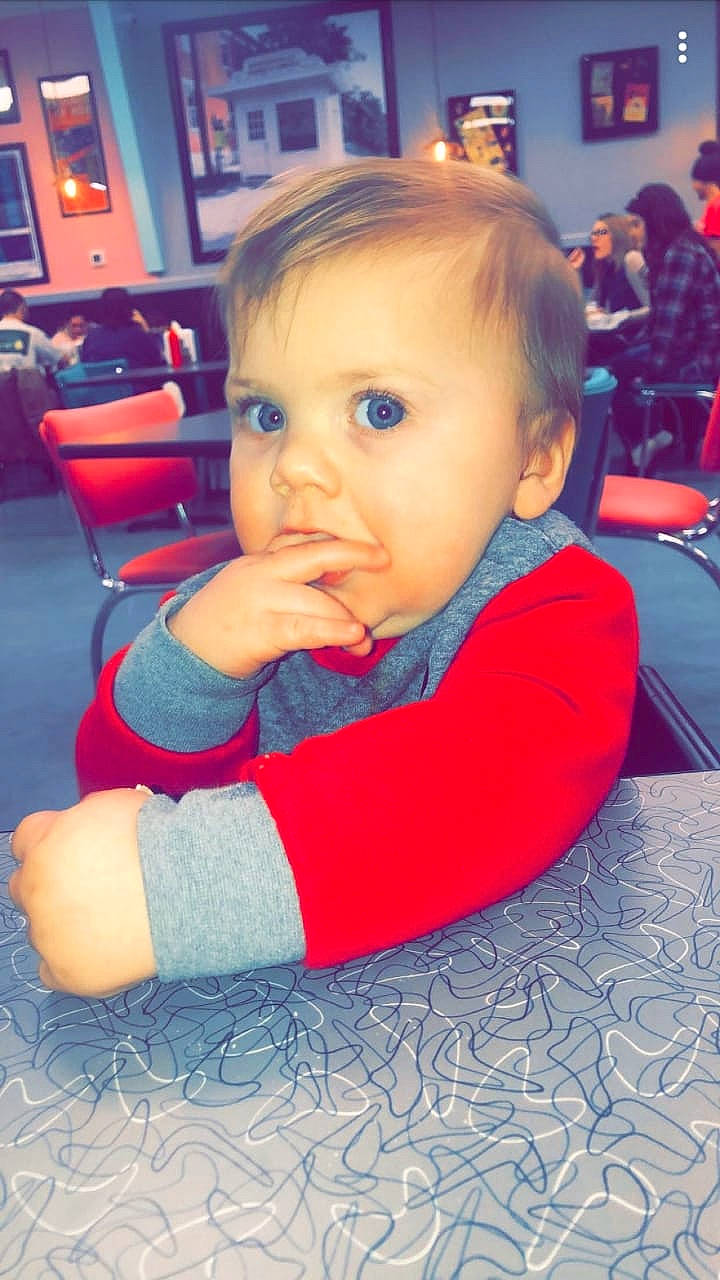 Brett is registered to the contest to win money with this photo: baby, cheek, child, eye, face, head, person, red, skin, toddler